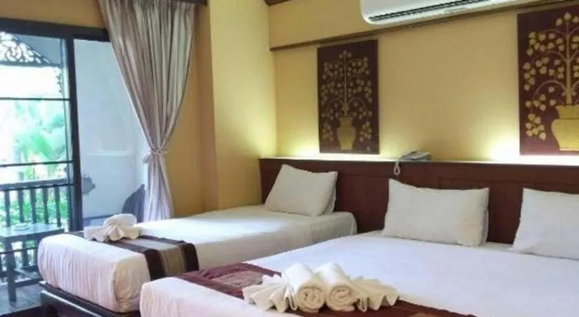 Bed in PhoomThai Garden Hotel