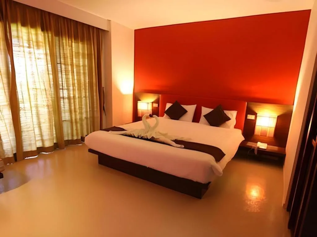 Bed in PhoomThai Garden Hotel