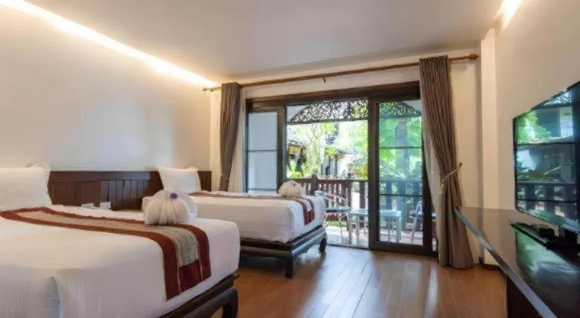 Bed in PhoomThai Garden Hotel