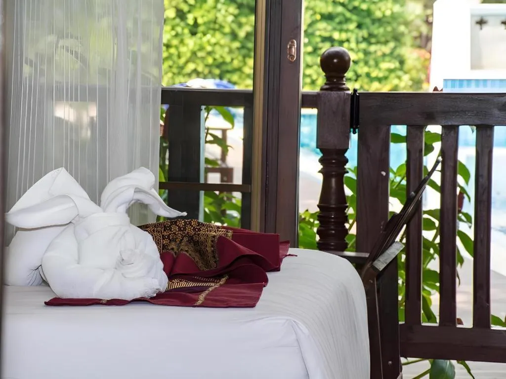 Bed in PhoomThai Garden Hotel