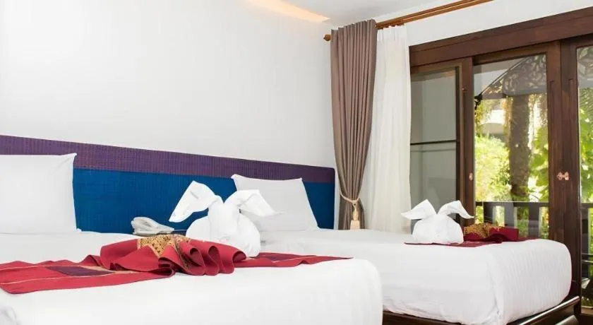 Bed in PhoomThai Garden Hotel