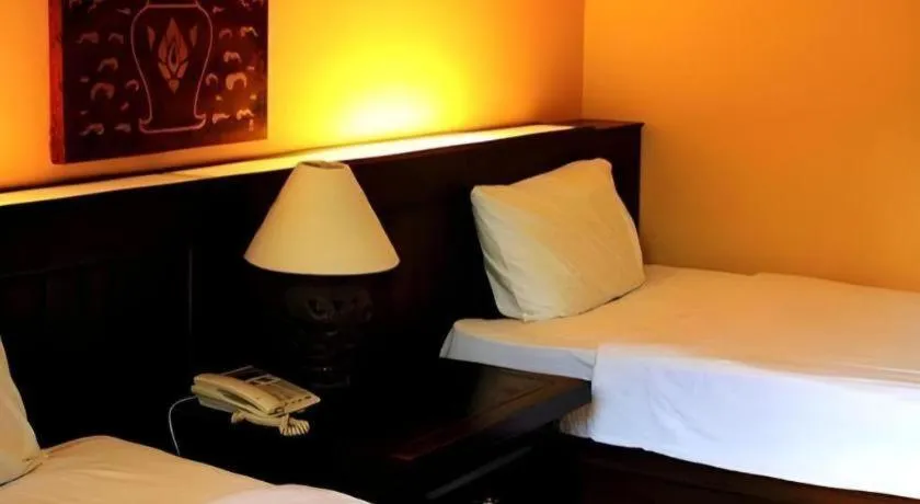 Bed in PhoomThai Garden Hotel