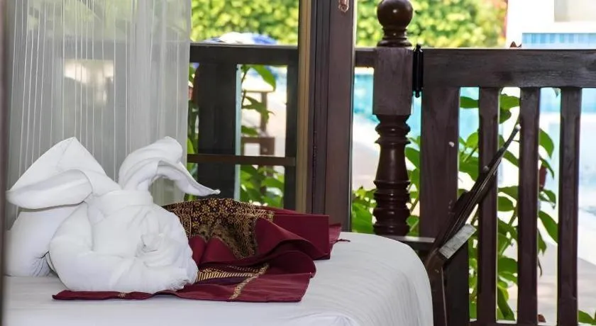 Bed in PhoomThai Garden Hotel