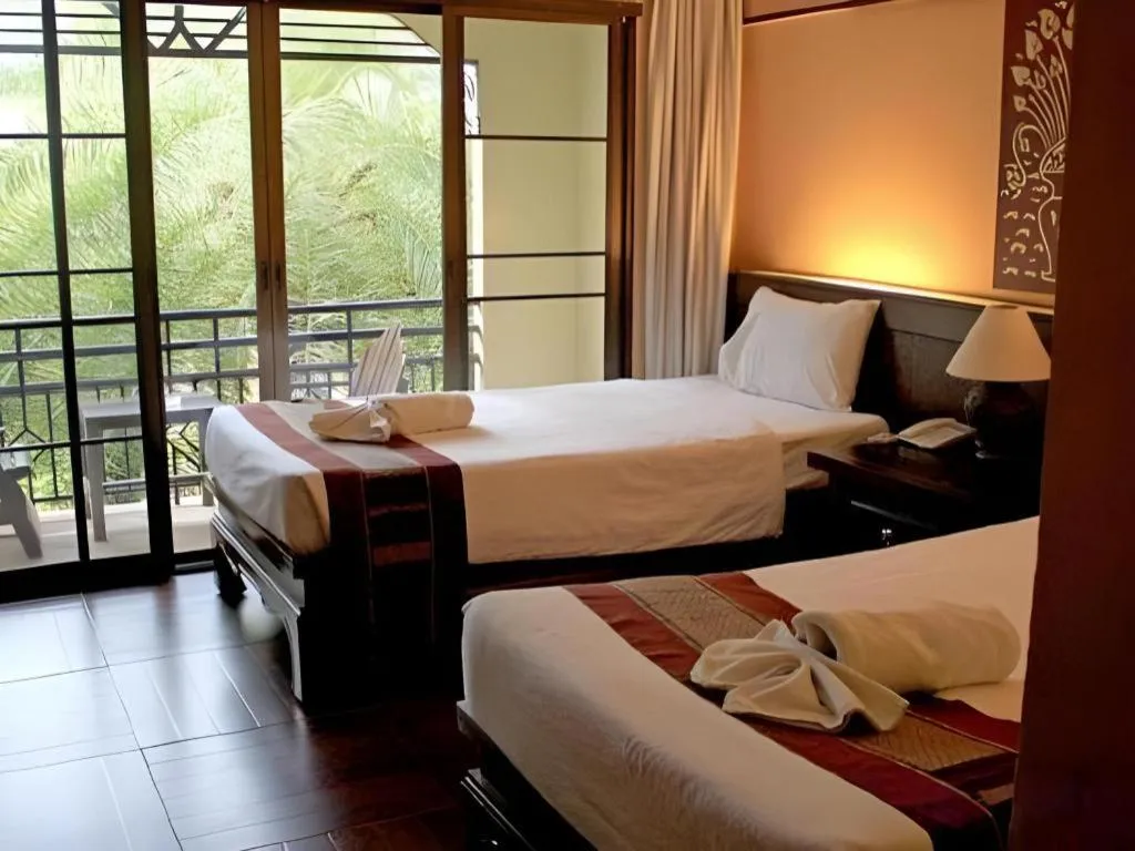 Bed in PhoomThai Garden Hotel