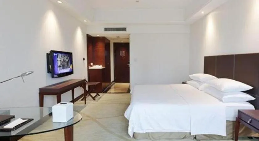 Bed in New Century Grand Hotel Zhuji Yaojiang