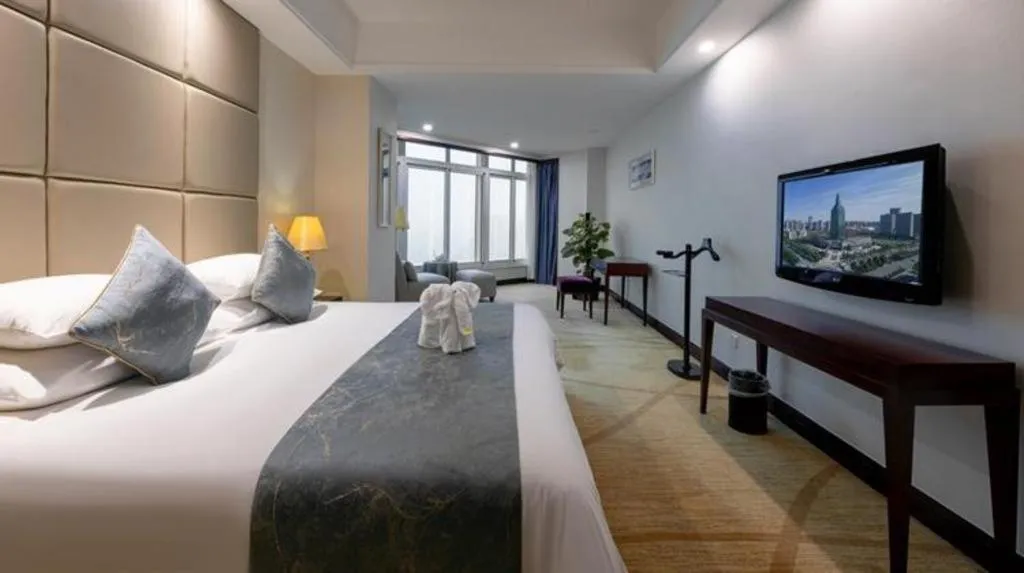 Bed in New Century Grand Hotel Zhuji Yaojiang