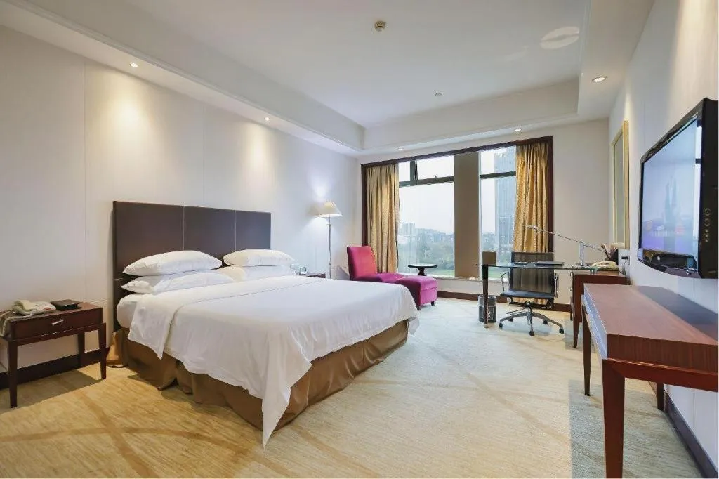 Bed in New Century Grand Hotel Zhuji Yaojiang