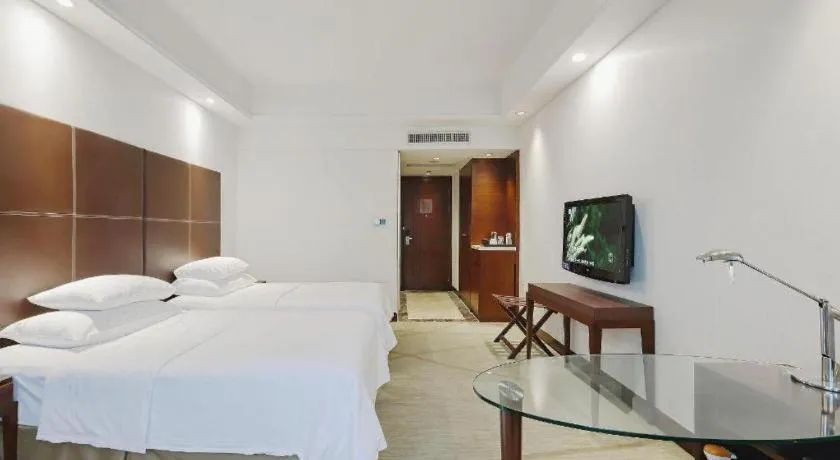 Bed in New Century Grand Hotel Zhuji Yaojiang