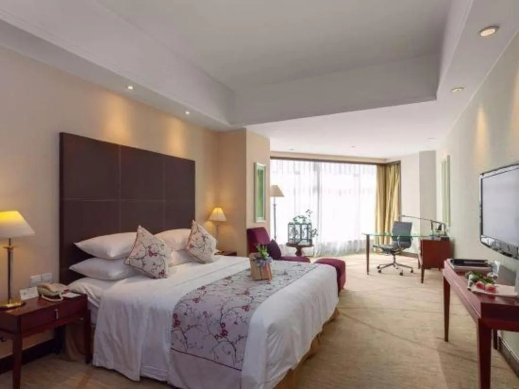 Bed in New Century Grand Hotel Zhuji Yaojiang