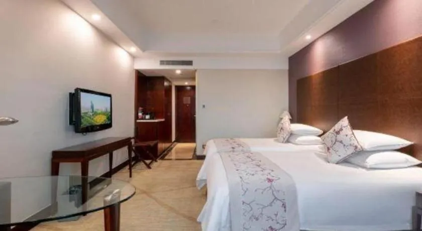 Bed in New Century Grand Hotel Zhuji Yaojiang