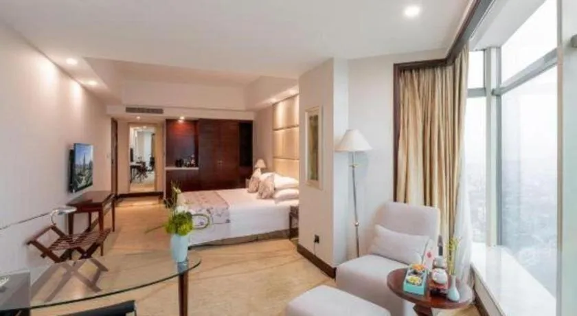 Bed in New Century Grand Hotel Zhuji Yaojiang