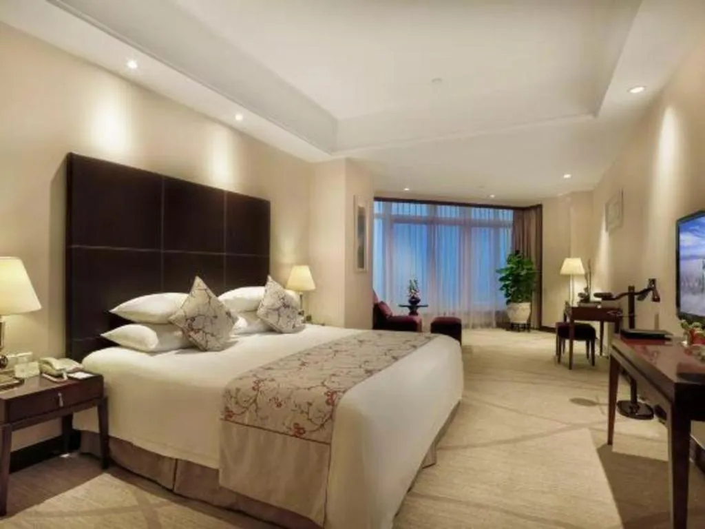 Bed in New Century Grand Hotel Zhuji Yaojiang