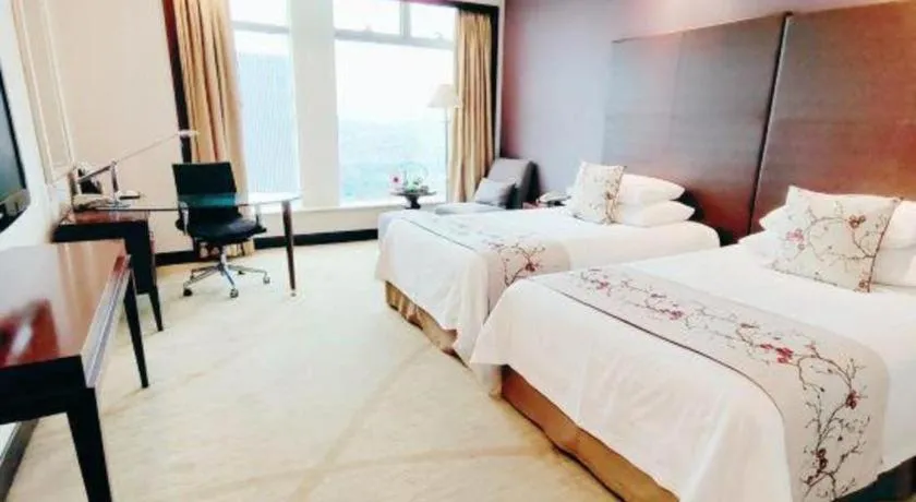 Bed in New Century Grand Hotel Zhuji Yaojiang