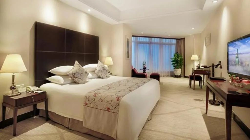 Bed in New Century Grand Hotel Zhuji Yaojiang