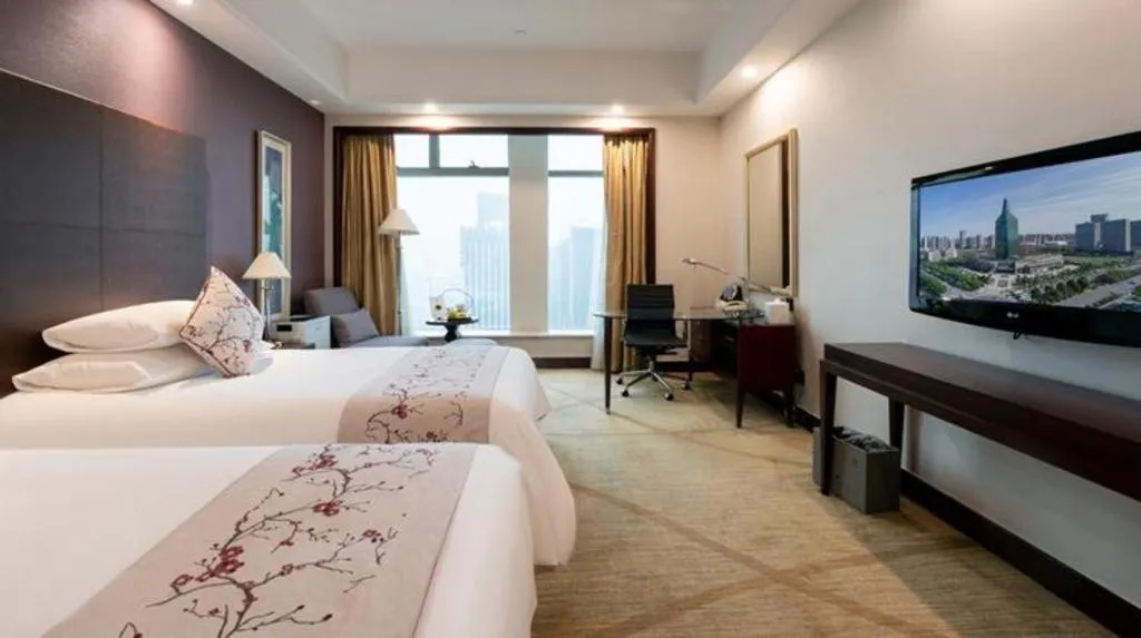 Bed in New Century Grand Hotel Zhuji Yaojiang