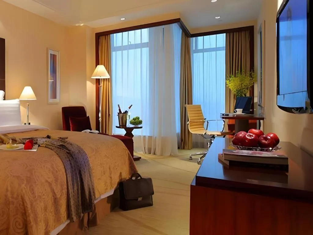 Bed in New Century Grand Hotel Zhuji Yaojiang