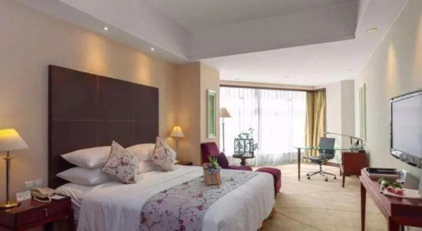 Bed in New Century Grand Hotel Zhuji Yaojiang