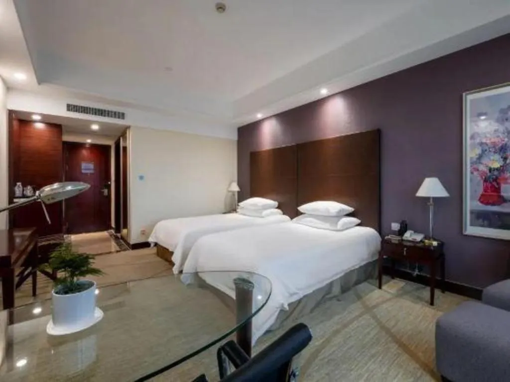 Bed in New Century Grand Hotel Zhuji Yaojiang