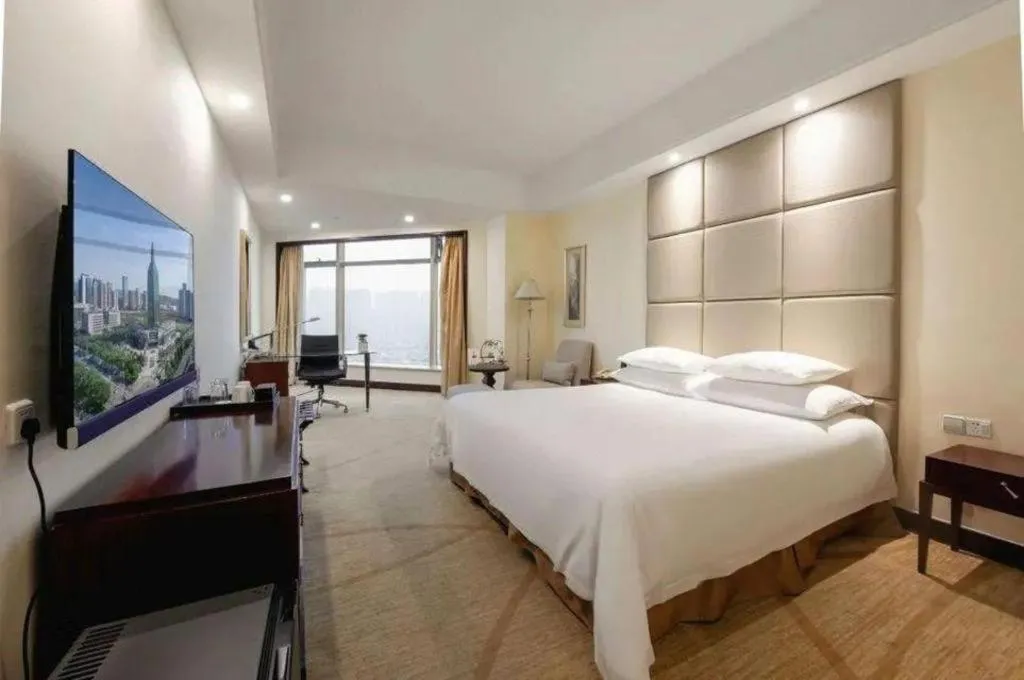 Bed in New Century Grand Hotel Zhuji Yaojiang
