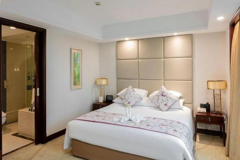 Bed in New Century Grand Hotel Zhuji Yaojiang