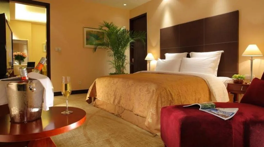 Bed in New Century Grand Hotel Zhuji Yaojiang