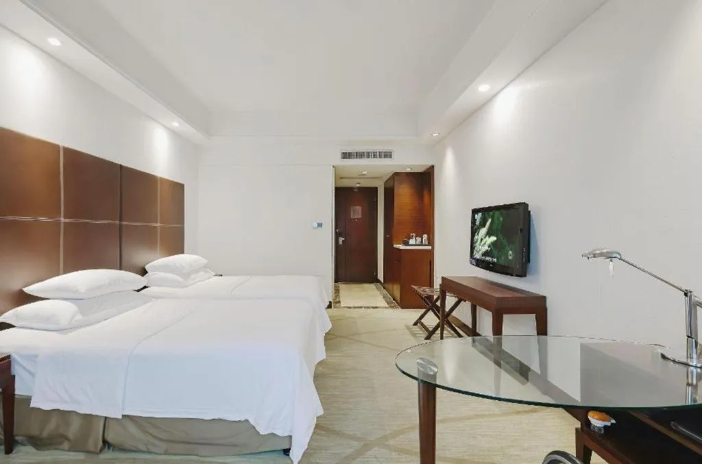 Bed in New Century Grand Hotel Zhuji Yaojiang