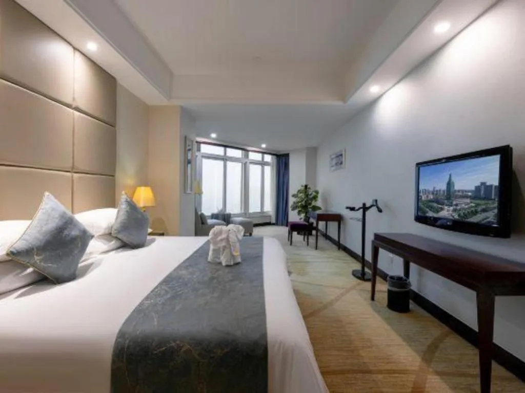 Bed in New Century Grand Hotel Zhuji Yaojiang
