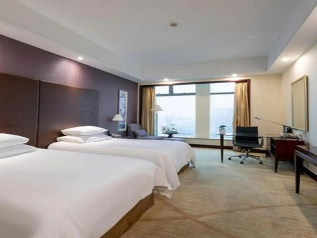 Bed in New Century Grand Hotel Zhuji Yaojiang