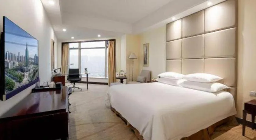 Bed in New Century Grand Hotel Zhuji Yaojiang