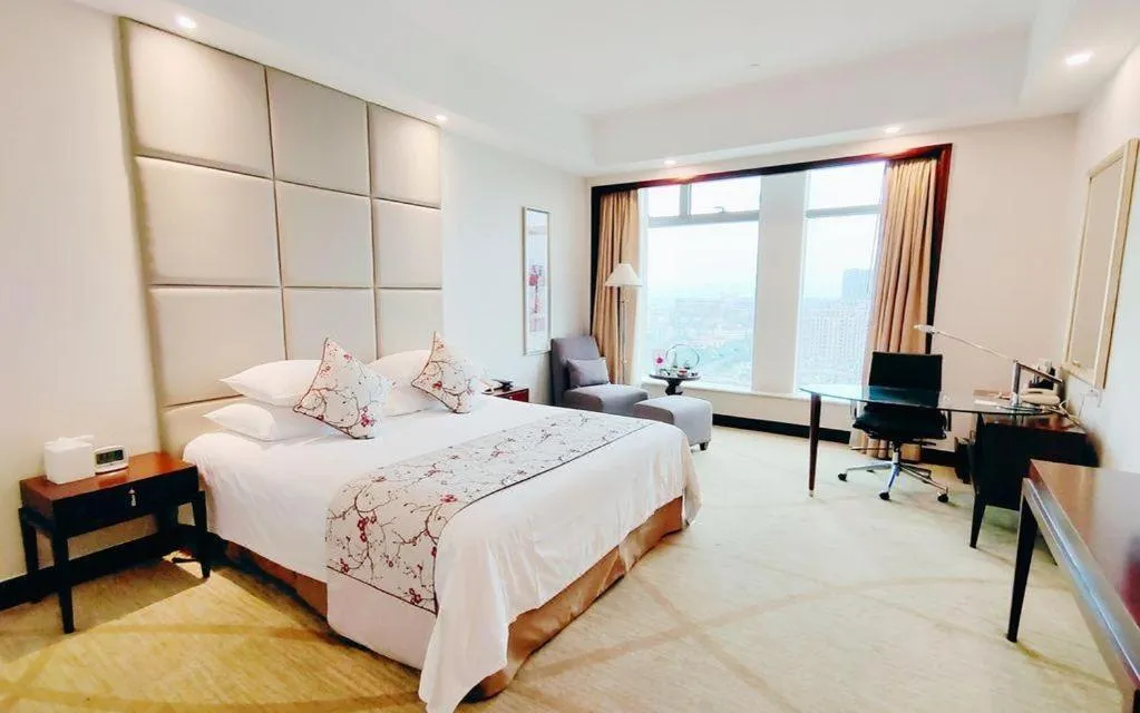 Bed in New Century Grand Hotel Zhuji Yaojiang