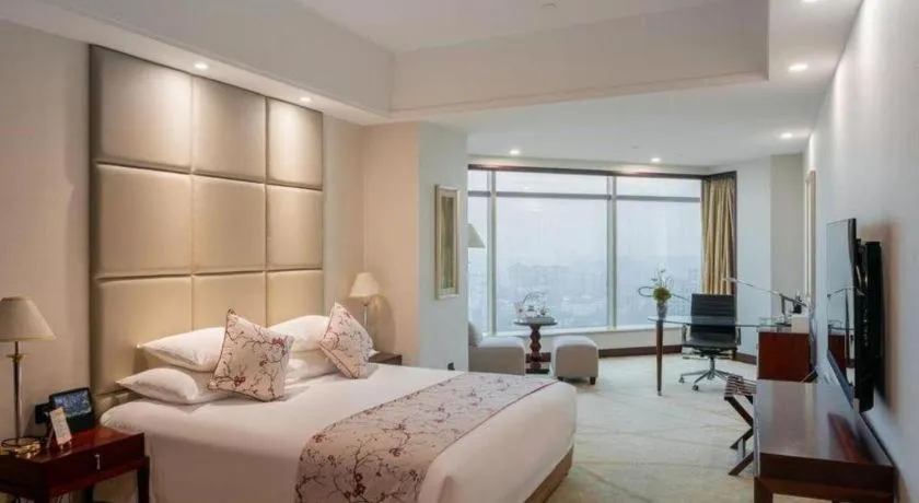 Bed in New Century Grand Hotel Zhuji Yaojiang