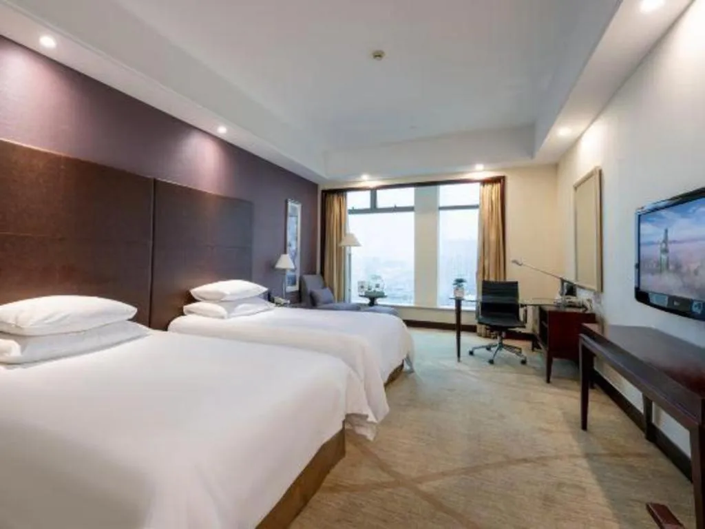 Bed in New Century Grand Hotel Zhuji Yaojiang