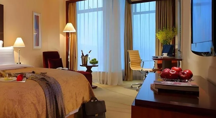 Bed in New Century Grand Hotel Zhuji Yaojiang