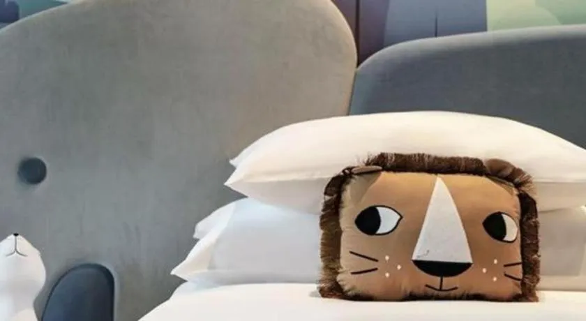 Bed in New Century Grand Hotel Zhuji Yaojiang