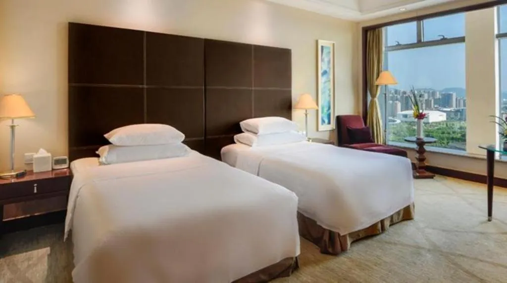 Bed in New Century Grand Hotel Zhuji Yaojiang