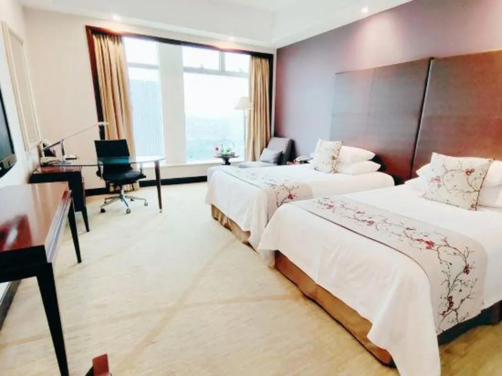 Bed in New Century Grand Hotel Zhuji Yaojiang