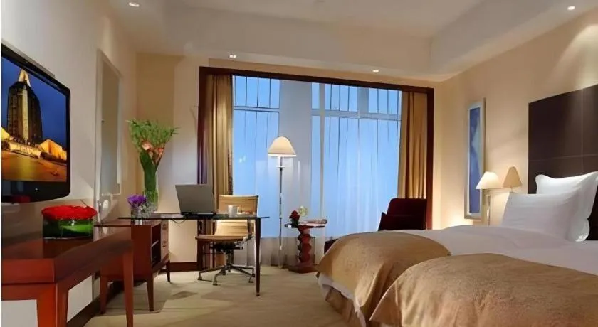 Bed in New Century Grand Hotel Zhuji Yaojiang