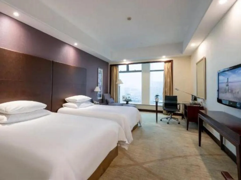 Bed in New Century Grand Hotel Zhuji Yaojiang