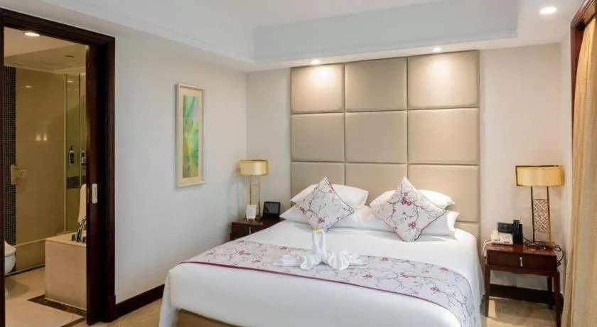 Bed in New Century Grand Hotel Zhuji Yaojiang