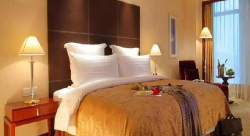 Bed in New Century Grand Hotel Zhuji Yaojiang