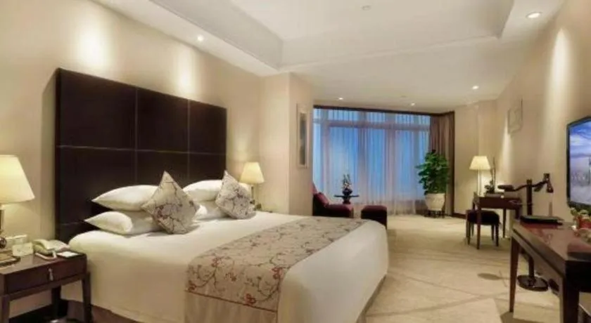 Bed in New Century Grand Hotel Zhuji Yaojiang