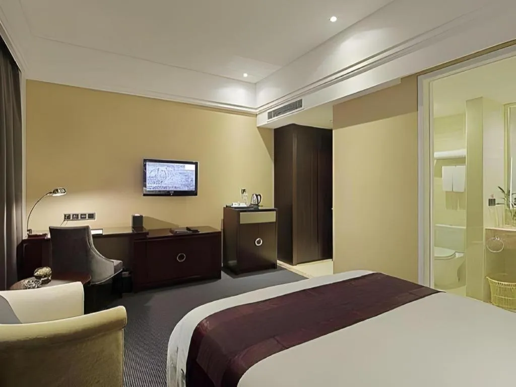 Bed in New Century Manju Hotel Shanghai New International Expo Center