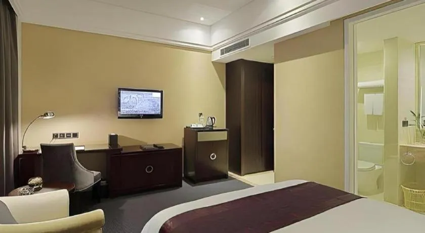 Bed in New Century Manju Hotel Shanghai New International Expo Center