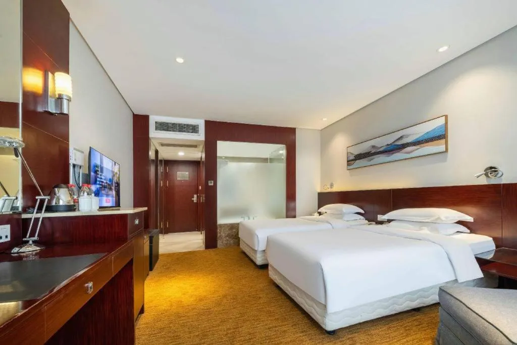 Bed in New Century Hotel Nanjing