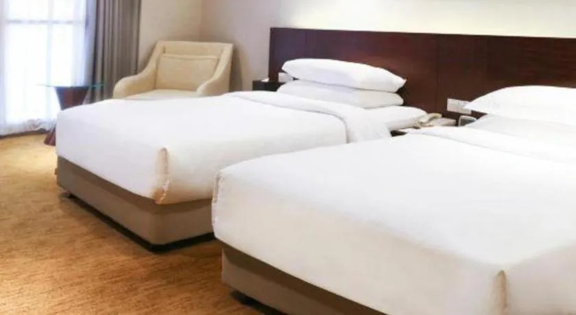 Bed in New Century Hotel Nanjing