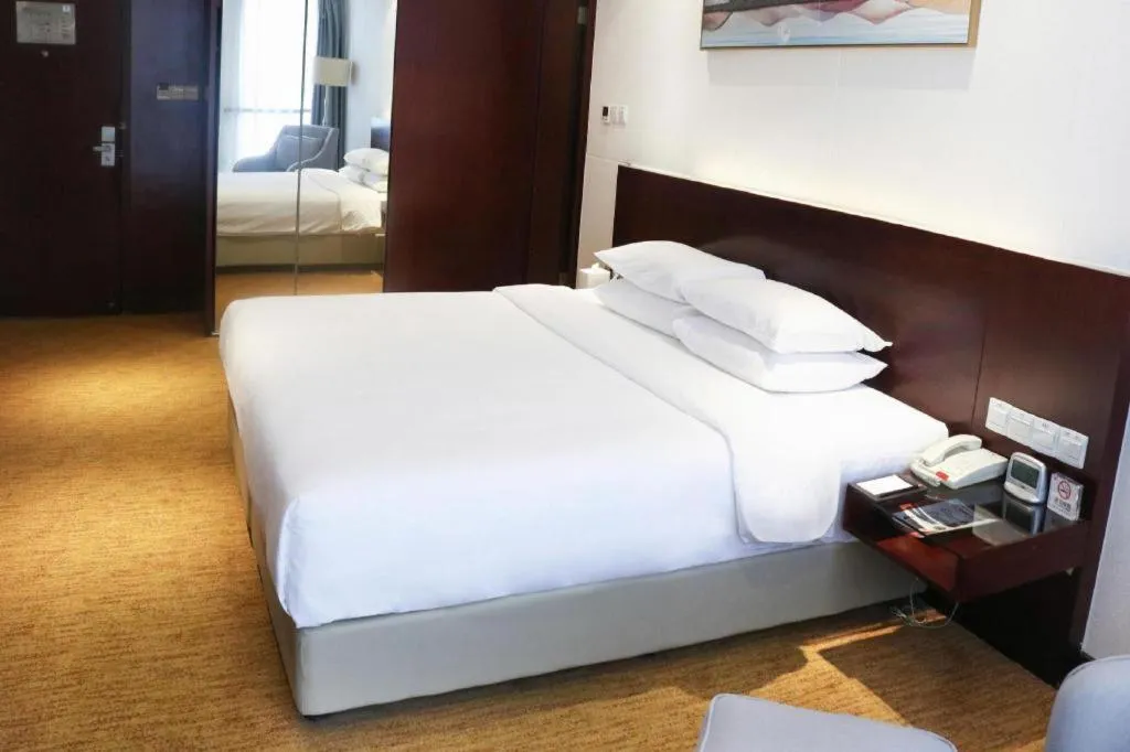 Bed in New Century Hotel Nanjing