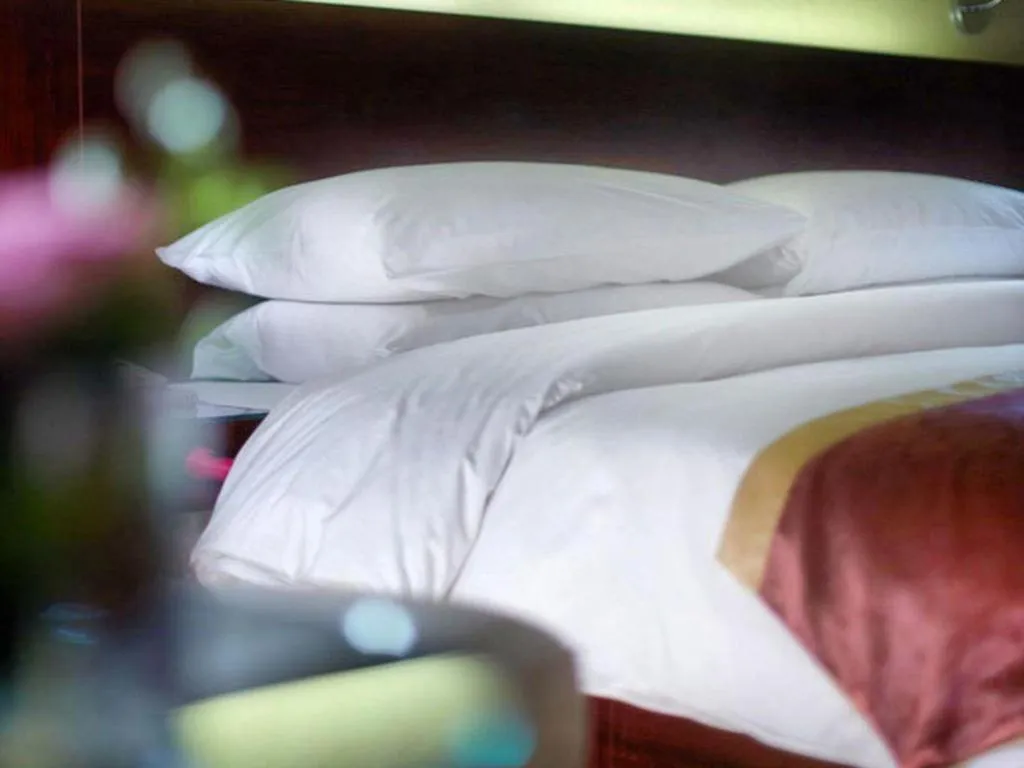 Bed in New Century Hotel Nanjing