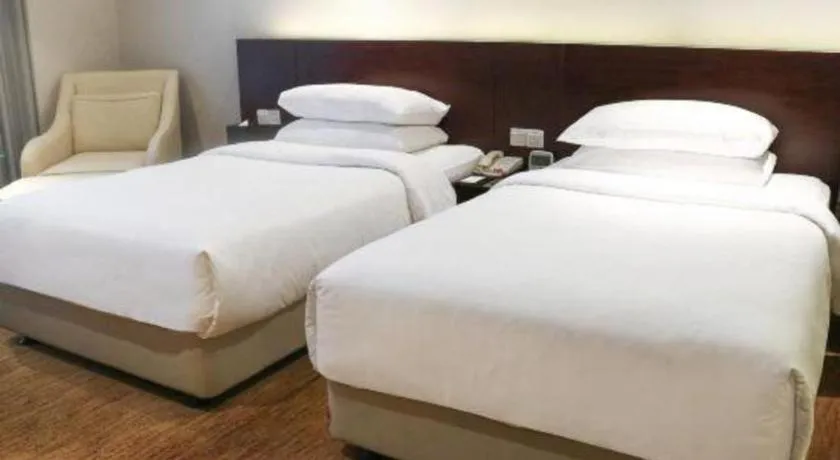 Bed in New Century Hotel Nanjing