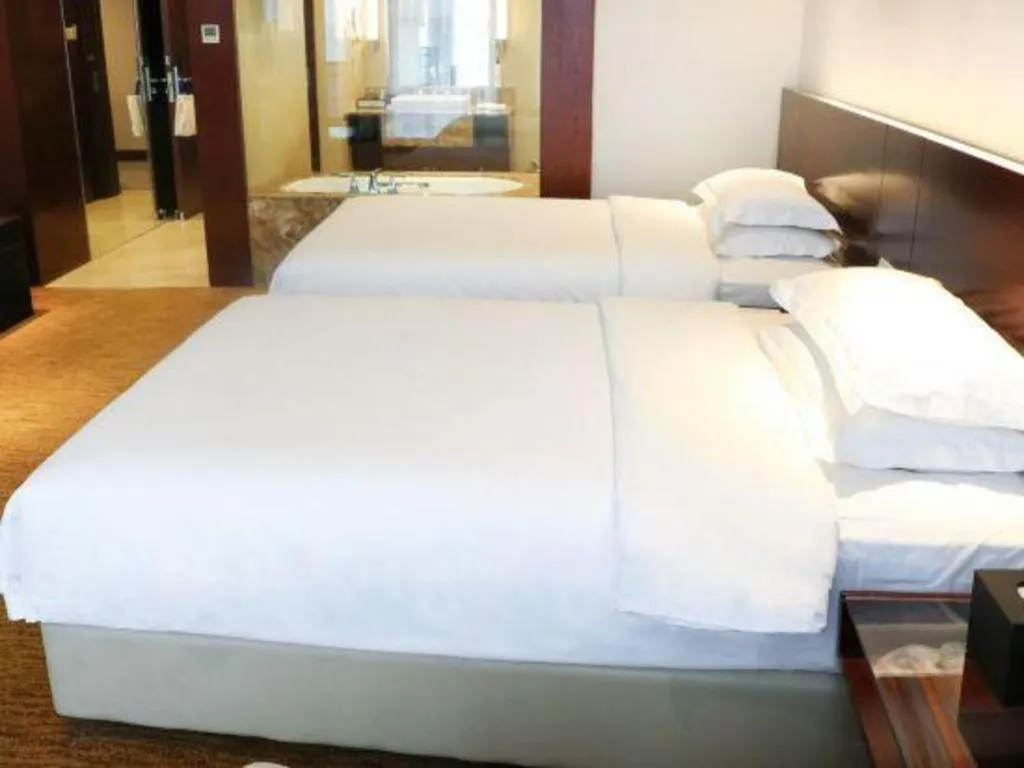 Bed in New Century Hotel Nanjing
