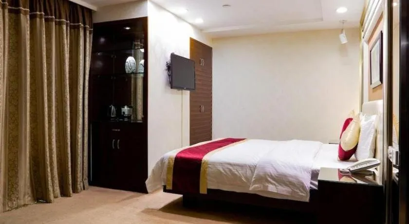 Bed in New World Hotel